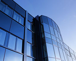 Office building with sun reflecting off.